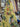 Floral patterned fabric with a yellow background draped in a store setting