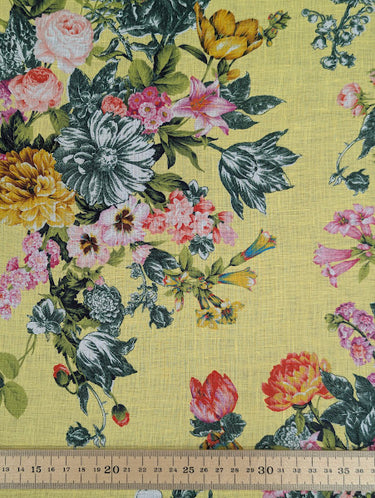 Floral patterned fabric on a yellow background with a ruler at the bottom for scale