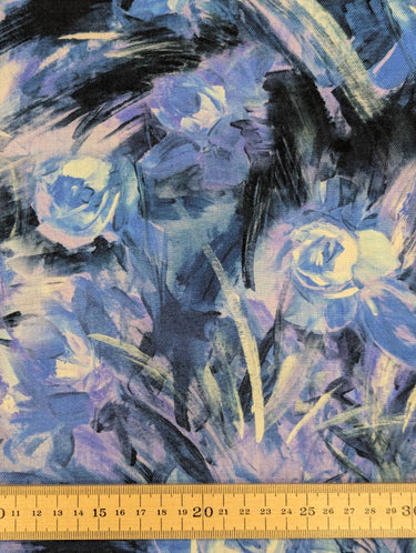 Pure wool fabric with blue and lavender abstract flowers shown with a ruler at the bottom for scale
