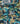 A close-up of draped Liberty Fabrics featuring a tropical botanical print with palm trees, monstera leaves, and blue flowers on a dark navy background with teal arches.