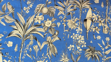 Botanical pattern with leaves, flowers, and birds on a blue background