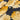 Close-up of a printed pure wool fabric with yellow flowers on a navy background