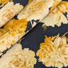 Close-up of a printed pure wool fabric with yellow flowers on a navy background