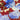 Close-up of a pure wool fabric with blue and white flowers on a red background