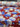 Printed pure wool fabric with blue and white flowers on a red background