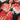 Close-up of printed pure wool fabric with pink and red flowers on a dark navy background